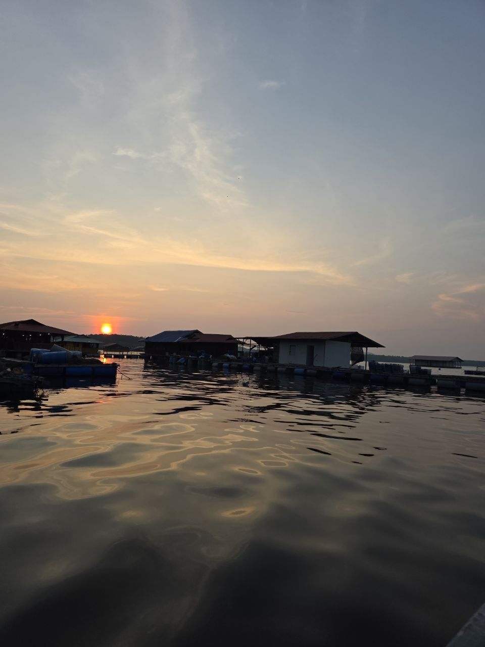 Oyster farm at sunset in Merbok